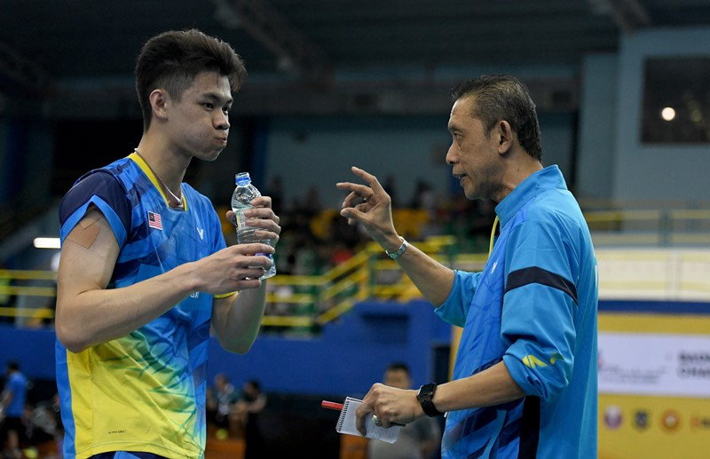 Coach encouraging player.